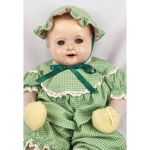 389 - An Original Vintage Possibly Antique German Baby Doll. It has flighty eyes that seem to follow you a... 