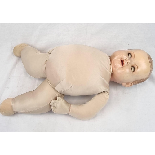 389 - An Original Vintage Possibly Antique German Baby Doll. It has flighty eyes that seem to follow you a... 