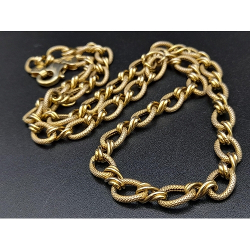 58 - A Sophisticated 14K Yellow Gold Oval and Twisted Link Chain. 86cm long. 12.7g. Lobster clasp. Ref - ... 