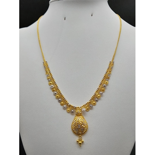 65 - A Glamourous 22k Yellow and White Gold Asian Design Necklace with Hanging Shell Pendant. 3 and 40cm.... 