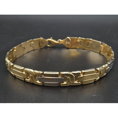 72 - A Stylish 14K Yellow and White Gold Link Bracelet.
18cm. 8.6g. Ref - 562