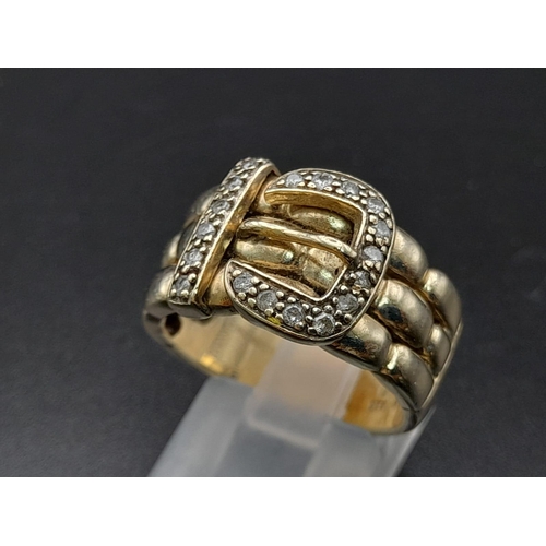 74 - A 9K Yellow Gold and Diamond Buckle Ring. 18 diamonds .25ct complement this keeper piece. Size Q. 9.... 