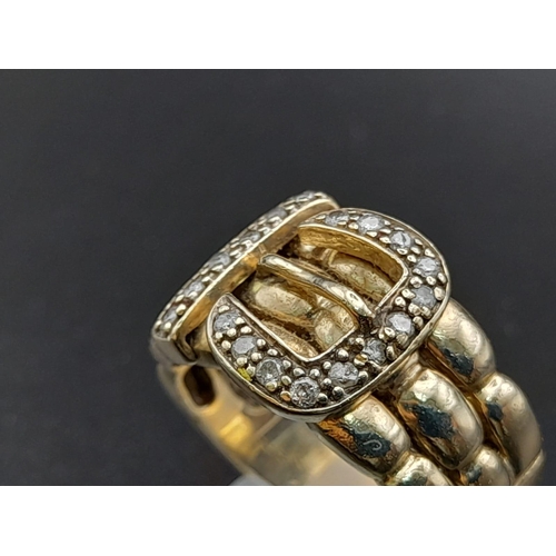 74 - A 9K Yellow Gold and Diamond Buckle Ring. 18 diamonds .25ct complement this keeper piece. Size Q. 9.... 