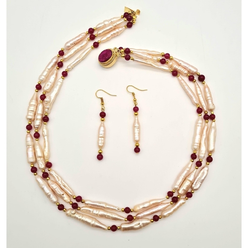 135 - A rarely seen, large Biwa pink pearls and round rubies three row necklace and earrings set in a pres... 