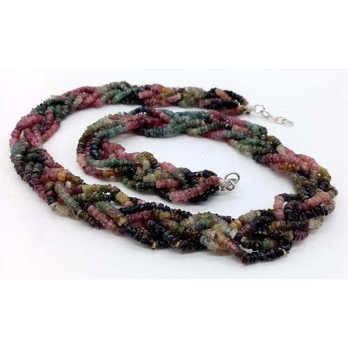 233 - A wonderful, braided, six strand, faceted, multi gem necklace. Length: 59 cm, weight: 94 g. In a pre... 