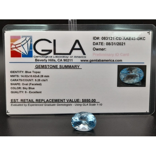 404 - An oval cut faceted blue topaz (9.25 carats) with GLA certificate. Dimensions: 14.02 x 10.62 x 8.28 ... 