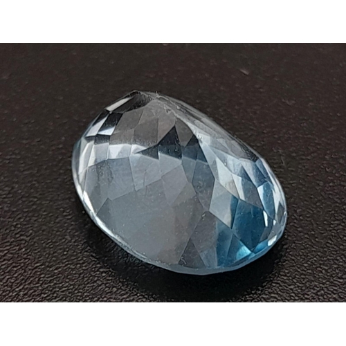 404 - An oval cut faceted blue topaz (9.25 carats) with GLA certificate. Dimensions: 14.02 x 10.62 x 8.28 ... 