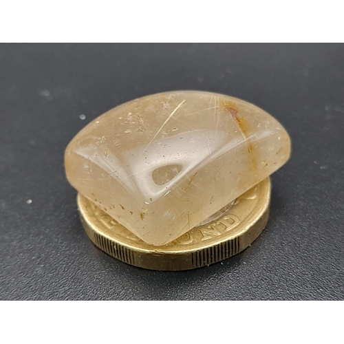 617 - A heavily rutilated quartz (35.90 carats) with GLA certificate. Dimensions: 26.64 x 22.22 x 9.22 mm.... 