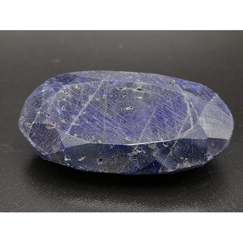 631 - An oval faceted blue sapphire composite (73.65 carats) with GLA certificate. Dimensions: 33.83 x 19.... 