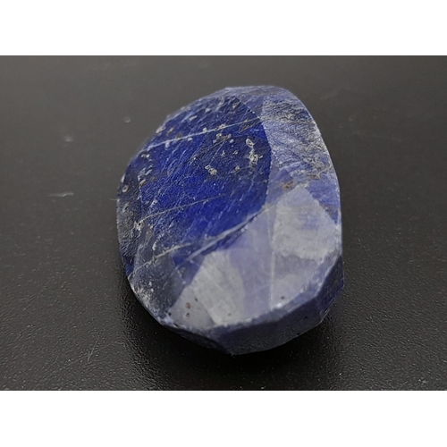 631 - An oval faceted blue sapphire composite (73.65 carats) with GLA certificate. Dimensions: 33.83 x 19.... 