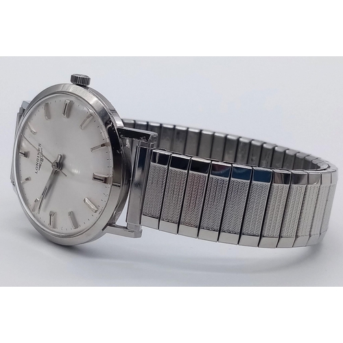 96 - A Classic 1970s Longines Gents Watch. Fitted with a speidel expandable stainless steel strap for add... 