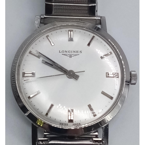 96 - A Classic 1970s Longines Gents Watch. Fitted with a speidel expandable stainless steel strap for add... 