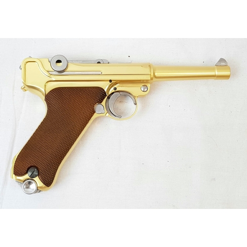 114 - A golden LUGER semi-automatic gas powered pistol. This is an exact replica of the real thing, firing... 