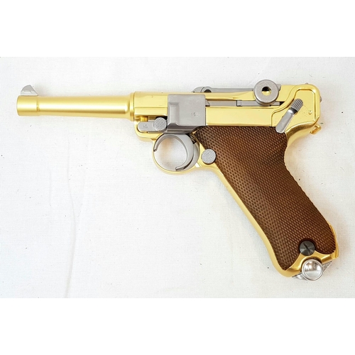 114 - A golden LUGER semi-automatic gas powered pistol. This is an exact replica of the real thing, firing... 