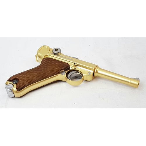 114 - A golden LUGER semi-automatic gas powered pistol. This is an exact replica of the real thing, firing... 