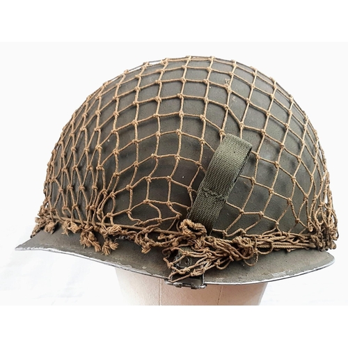 280 - WW2 US M1 Swivel Bale Helmet with front split seam. Nice clean example with original cam net.