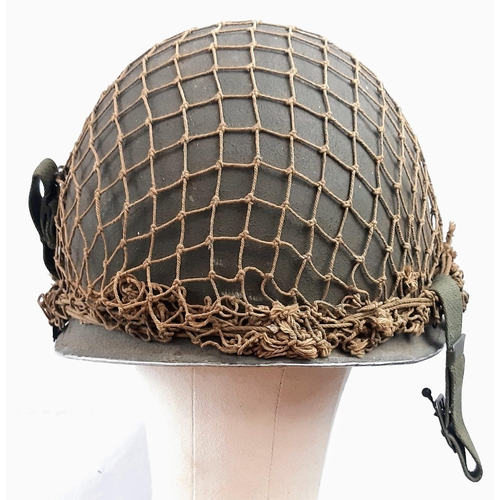 280 - WW2 US M1 Swivel Bale Helmet with front split seam. Nice clean example with original cam net.