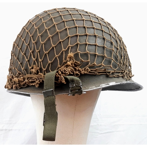 280 - WW2 US M1 Swivel Bale Helmet with front split seam. Nice clean example with original cam net.