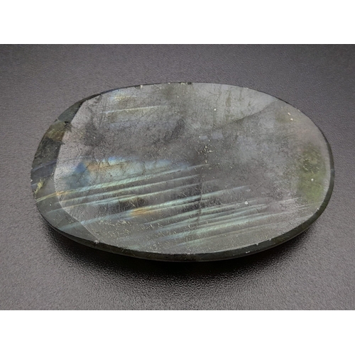 411 - An oval carved labradorite (113.95 carats) with GLA certificate. Dimensions: 49.70 x 32.86 x 8.28 mm... 