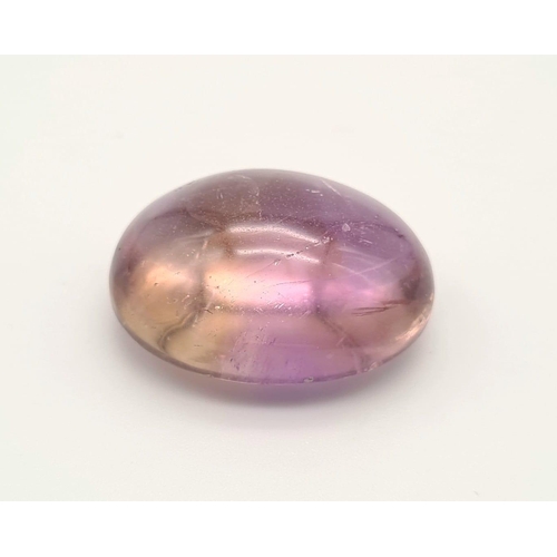 531 - A large oval cabochon natural bicolour ametrine (54.10 carats) with GLA Certificate. Dimensions: 29.... 