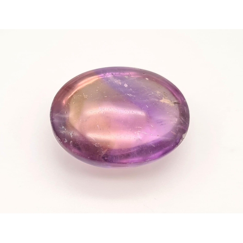 531 - A large oval cabochon natural bicolour ametrine (54.10 carats) with GLA Certificate. Dimensions: 29.... 