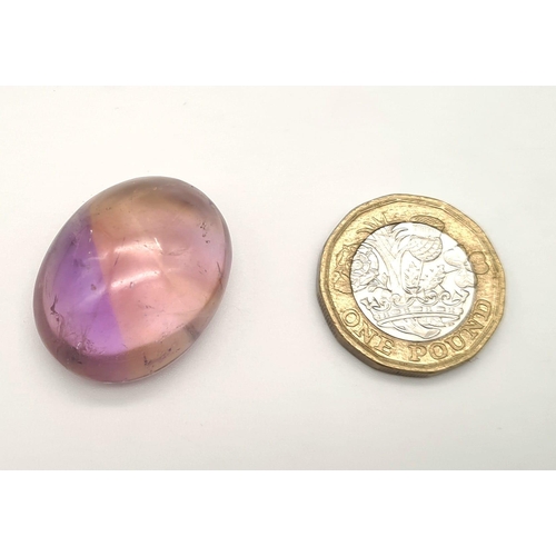 531 - A large oval cabochon natural bicolour ametrine (54.10 carats) with GLA Certificate. Dimensions: 29.... 