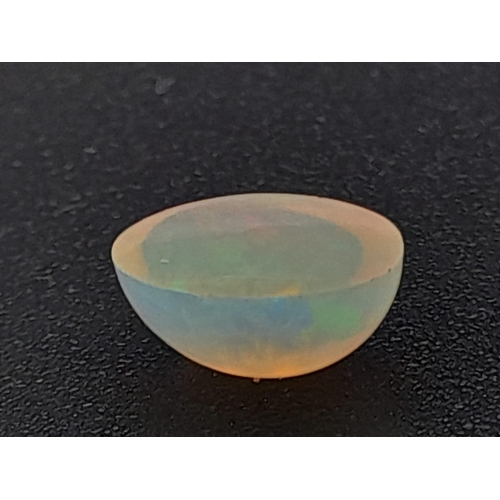 603 - A fire opal cabochon (0.65 carats) with GLA certificate. Dimensions: 6.84 x 5.20 x 3.50 mm. Original... 