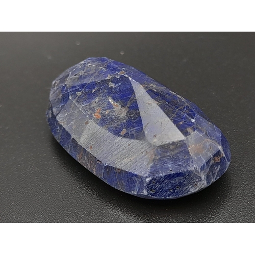 631 - An oval faceted blue sapphire composite (73.65 carats) with GLA certificate. Dimensions: 33.83 x 19.... 