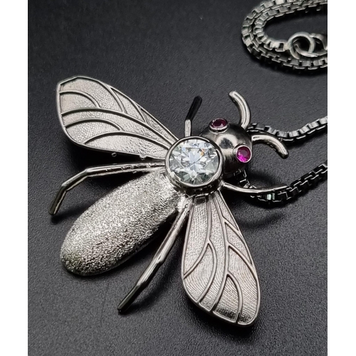 753 - 26 grams Sterling Silver bee pendant with a 2.5cts White Moissanite, with a long sterling silver cha... 