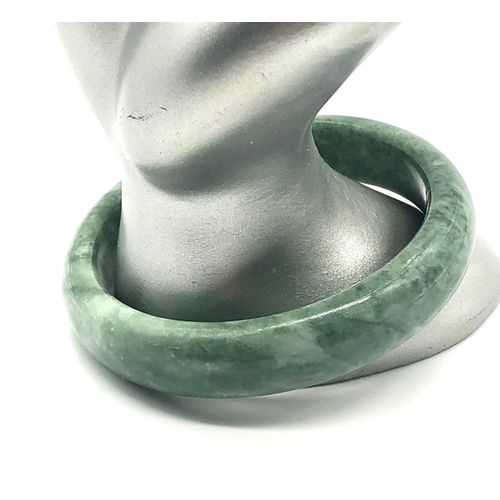 767 - A Green Jade Bangle. Inner diameter 6cm.