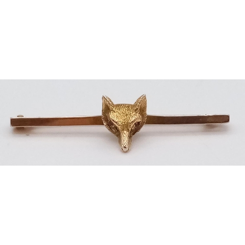 993 - A Vintage 9K Yellow Gold Fox Brooch with Ruby Eyes. 
3.5cm. 2.2g total weight.