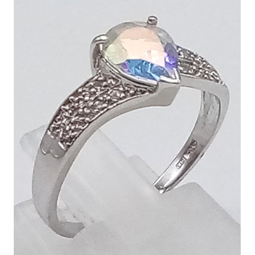 621 - A 9K Gold Topaz and Diamond Ring. Teardrop central topaz with smaller diamonds on shoulders. Size M ... 