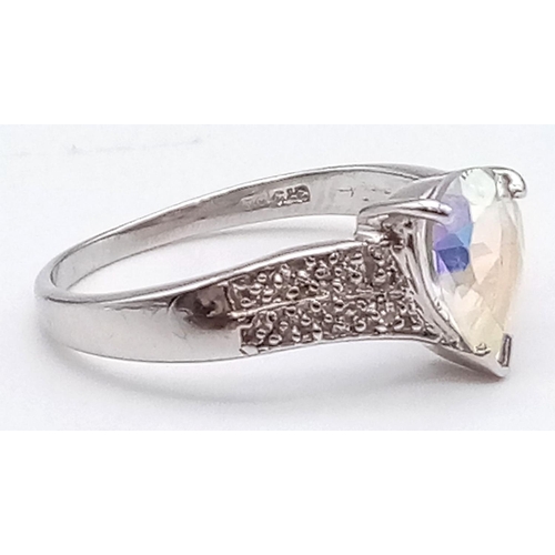 621 - A 9K Gold Topaz and Diamond Ring. Teardrop central topaz with smaller diamonds on shoulders. Size M ... 