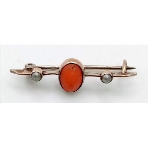 587 - An Antique Coral and Seed Pearl Brooch on Gilded Metal.
3cm.