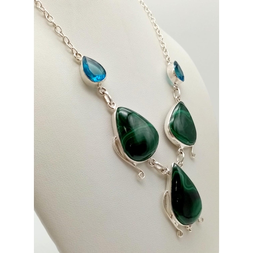 580 - A Malachite and Topaz Teardrop Necklace. Set in white metal. 40cm.