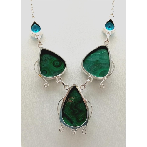 580 - A Malachite and Topaz Teardrop Necklace. Set in white metal. 40cm.