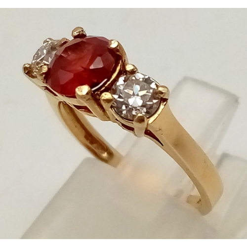 208 - 14k yellow gold trilogy ring with ruby and diamonds. Ring size K. Centre ruby 6mm diameter. Total we... 