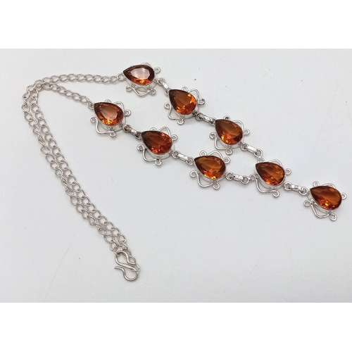 573 - A Citrine Teardrop White Metal Necklace. 44cm.