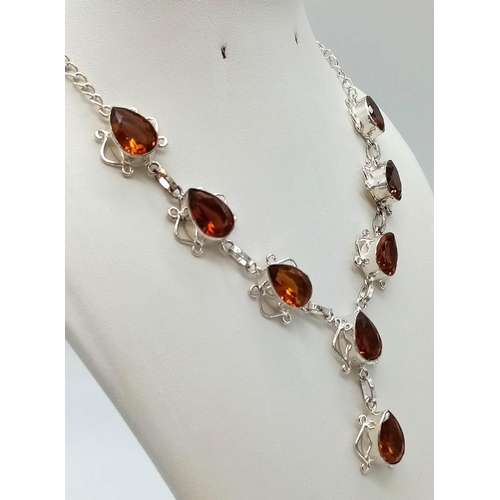 573 - A Citrine Teardrop White Metal Necklace. 44cm.