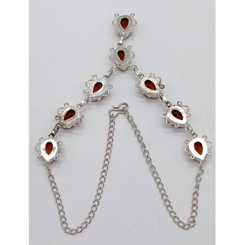 573 - A Citrine Teardrop White Metal Necklace. 44cm.