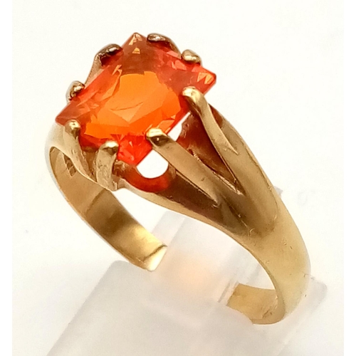 129 - 9ct yellow hand made gold ring with vivid orange fire opal. 10mmx8mm, ring size Z+1