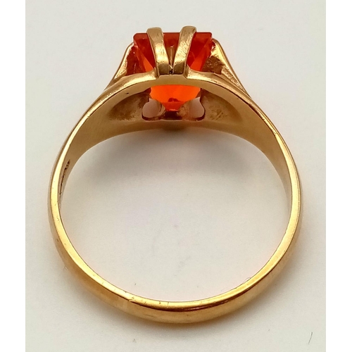 129 - 9ct yellow hand made gold ring with vivid orange fire opal. 10mmx8mm, ring size Z+1