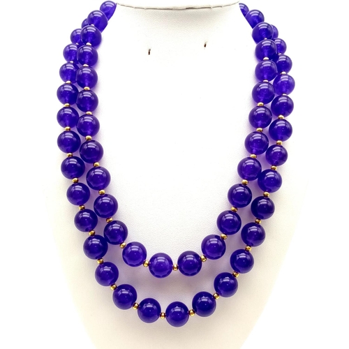 543 - A Purple Jade Two-Strand Bead Necklace with Gilded Spacers and Clasp. 42cm. 12mm beads.