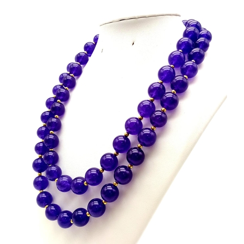 543 - A Purple Jade Two-Strand Bead Necklace with Gilded Spacers and Clasp. 42cm. 12mm beads.