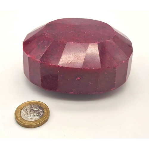 146 - A massive (2,468.45 carats) oval faceted ruby with GLA certificate. Dimensions: 85.31 x 70.03 x 42.9... 