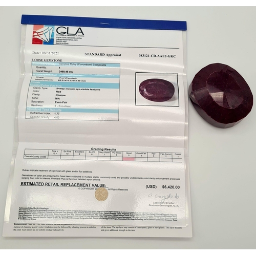 146 - A massive (2,468.45 carats) oval faceted ruby with GLA certificate. Dimensions: 85.31 x 70.03 x 42.9... 