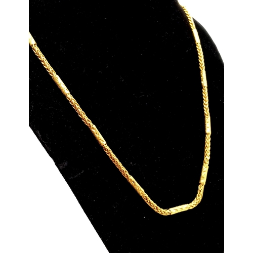 17 - A 23K Yellow Gold Foxtail-Bar-Link Chain. 56cm. 45.22g.
Tiny hole damage on one bar so a/f. Ref - 87... 