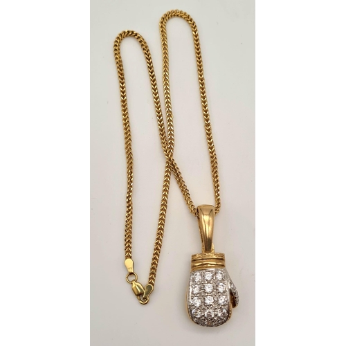 34 - A 9K Yellow Gold Necklace with a 9K Gold White Stone Decorated Boxing Pendant. 4 and 40cm. 32.85g to... 