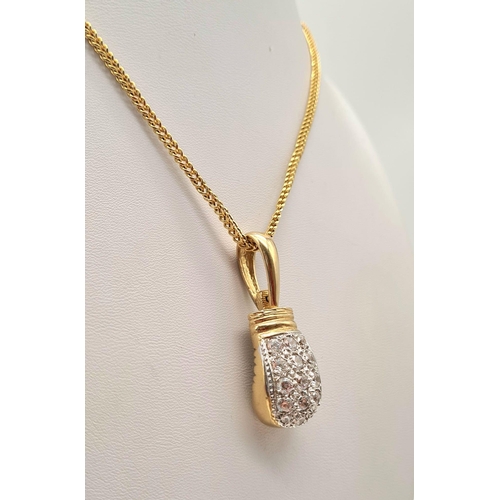 34 - A 9K Yellow Gold Necklace with a 9K Gold White Stone Decorated Boxing Pendant. 4 and 40cm. 32.85g to... 