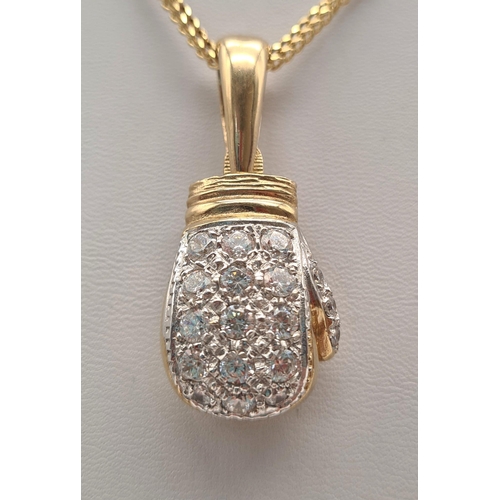 34 - A 9K Yellow Gold Necklace with a 9K Gold White Stone Decorated Boxing Pendant. 4 and 40cm. 32.85g to... 